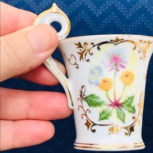 Miniature Ucagco porcelain tea cup with lovely flowers. Vintage